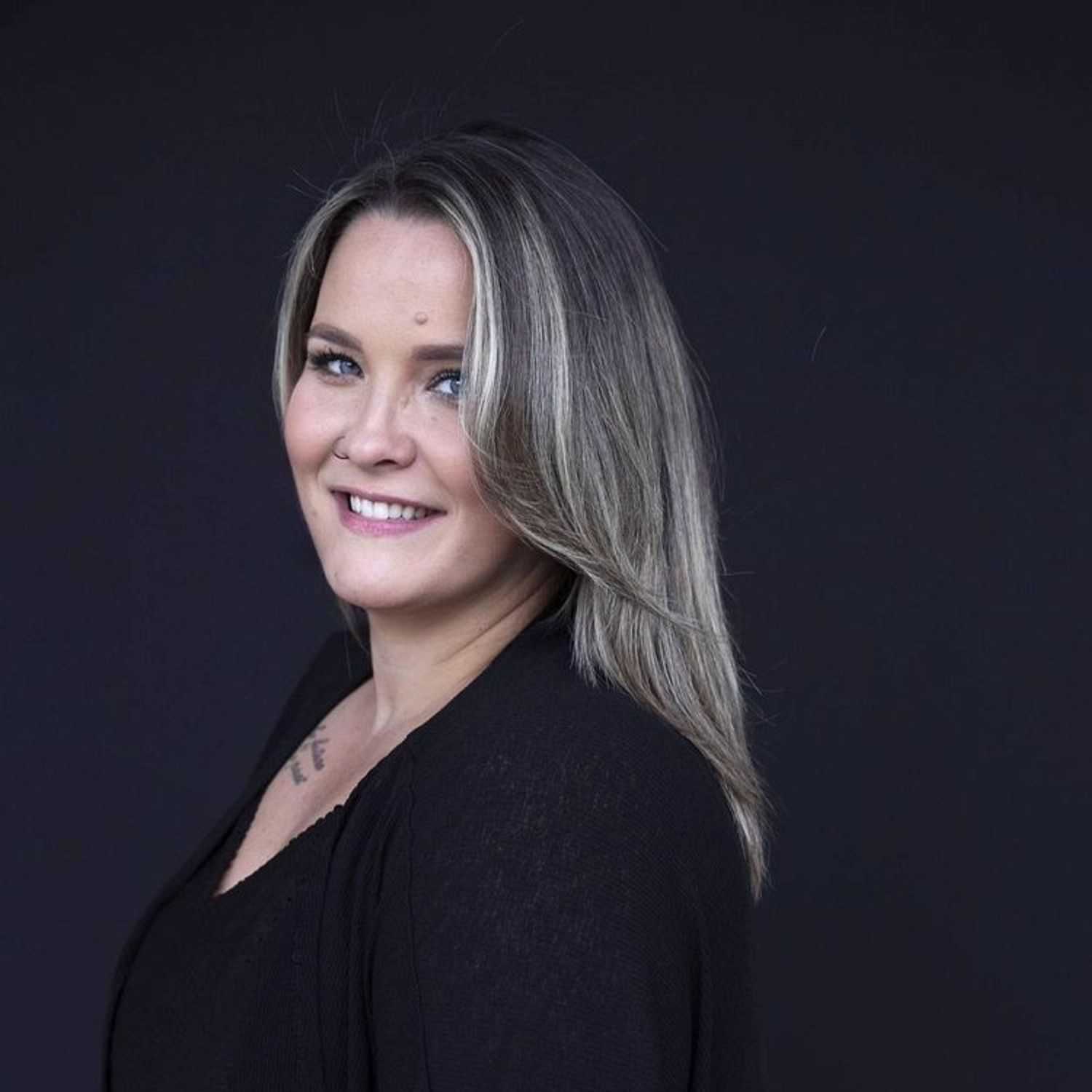 Portrait of Courtney, a professional stylist at Avanté Salon & Spa, showcasing their expertise and style.