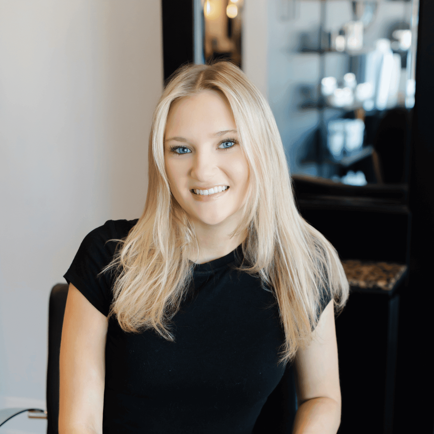 Portrait of Rachel, a professional stylist at Avanté Salon & Spa, showcasing their expertise and style.