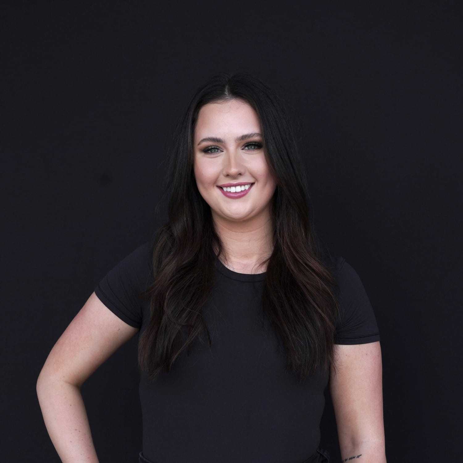 Portrait of Sam, a professional stylist at Avanté Salon & Spa, showcasing their expertise and style.