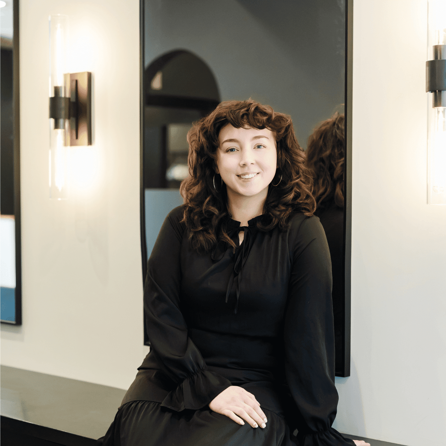 Portrait of Allie, a professional stylist at Avanté Salon & Spa, showcasing their expertise and style.