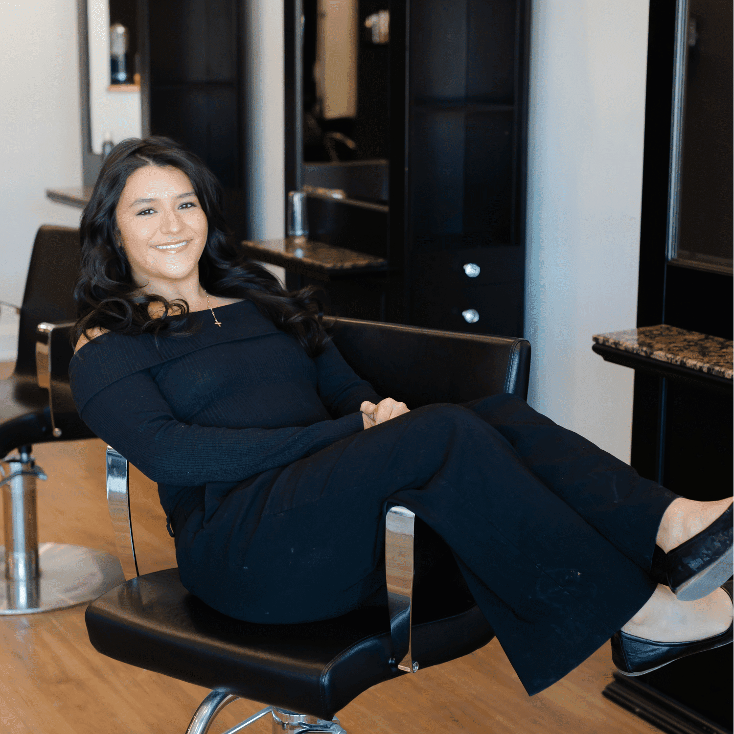 Portrait of Jazzy, a professional stylist at Avanté Salon & Spa, showcasing their expertise and style.