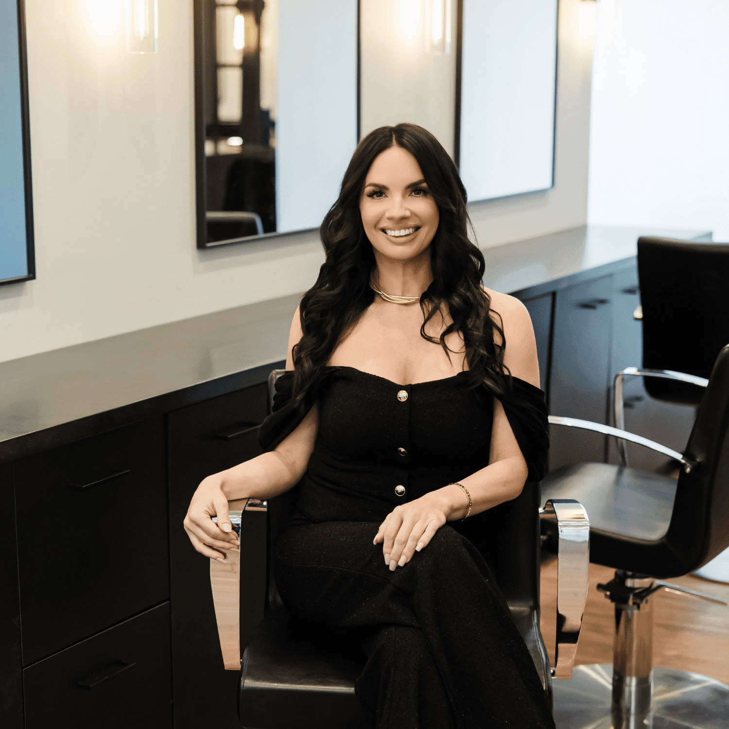 Portrait of Kira, a professional stylist at Avanté Salon & Spa, showcasing their expertise and style.