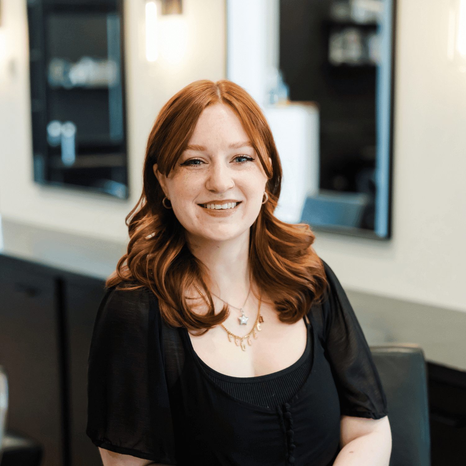 Portrait of Rebecca, a professional stylist at Avanté Salon & Spa, showcasing their expertise and style.