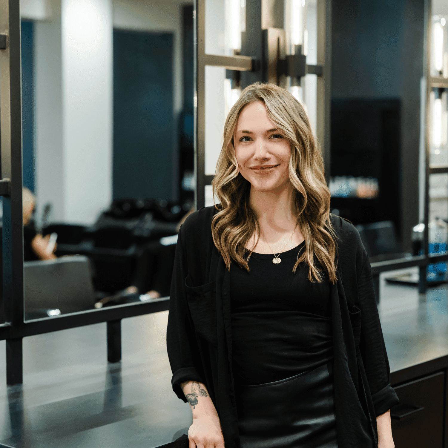 Portrait of Shawn, a professional stylist at Avanté Salon & Spa, showcasing their expertise and style.