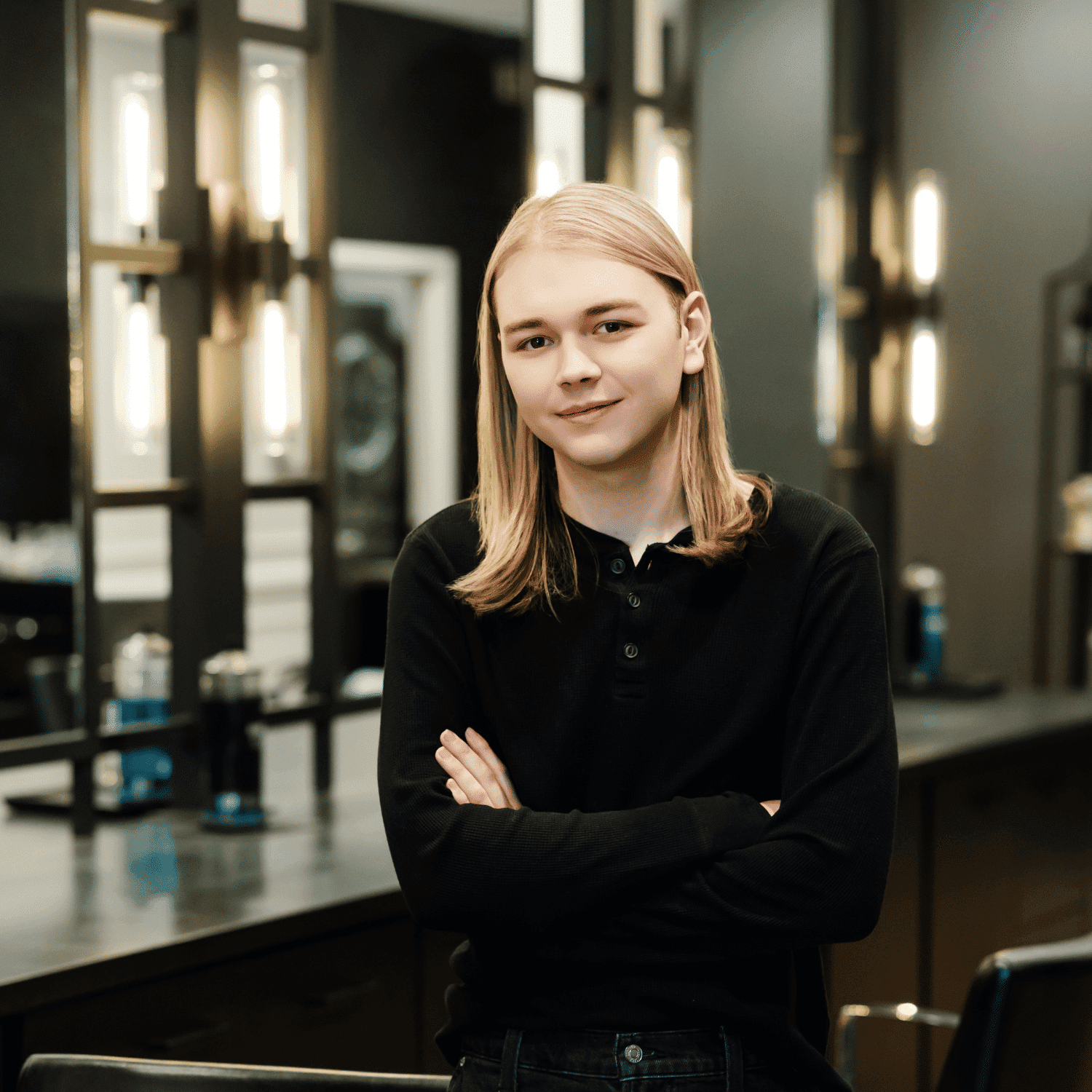 Portrait of Max, a professional stylist at Avanté Salon & Spa, showcasing their expertise and style.